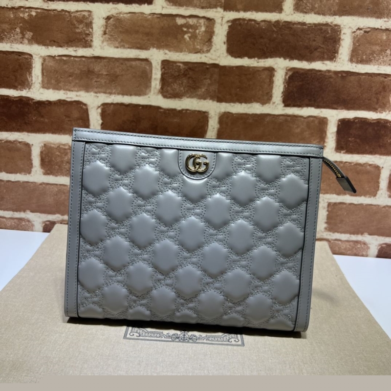 G*u*i clutch bags